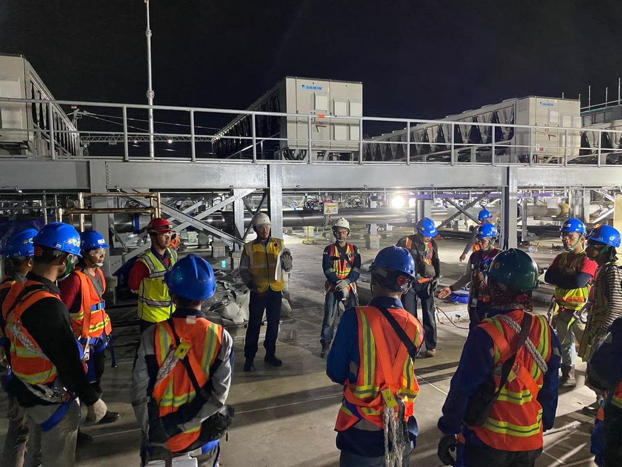 NTS engineering team night briefing on rooftop